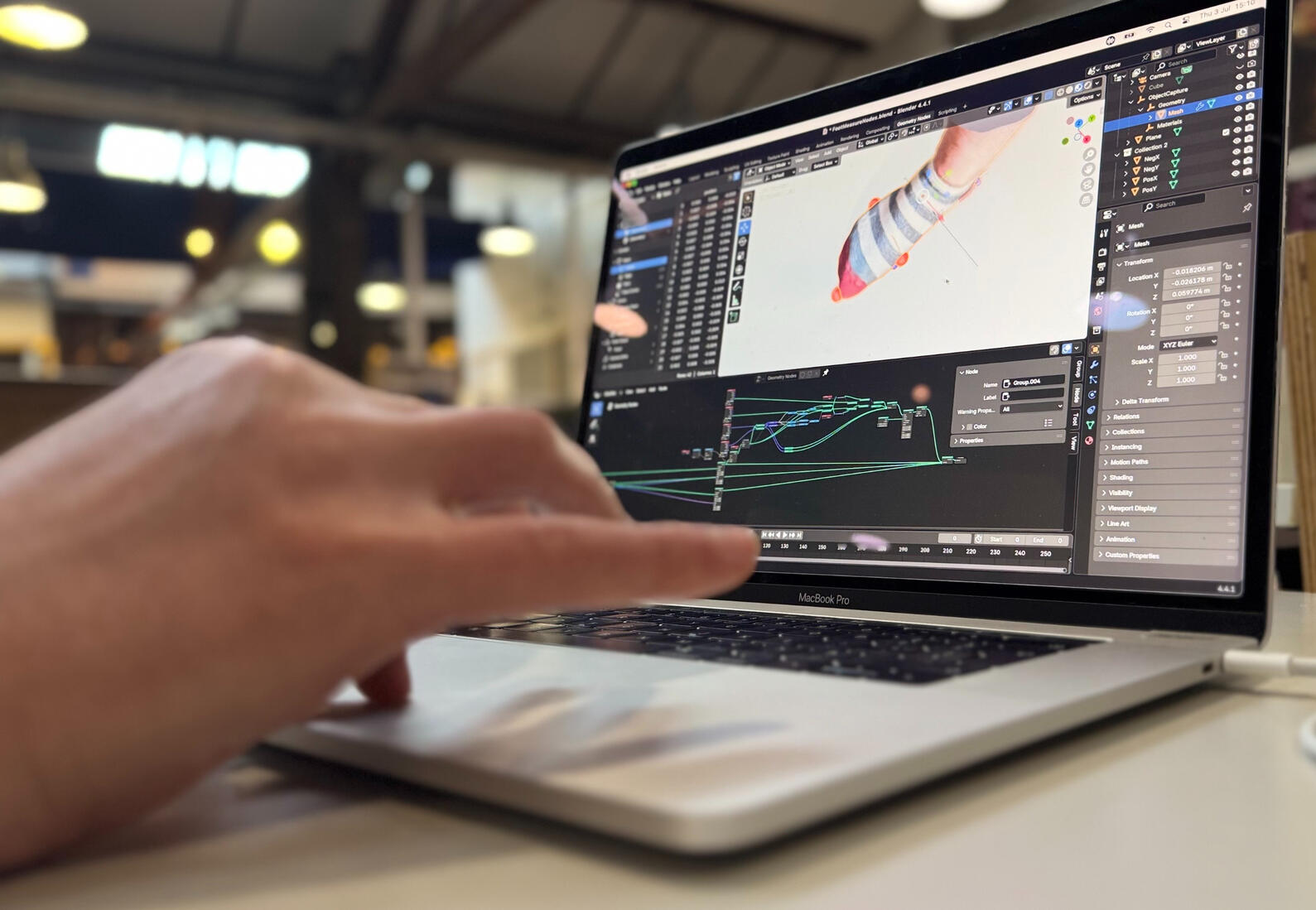 A creative technologist working with a 3D hand model & node-based material tools.